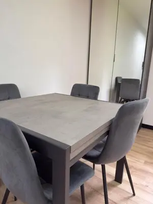 a conference room with a table and chairs at Regina del bosco in Ronzone