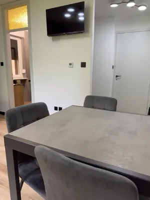a conference room with a table and two chairs at Regina del bosco in Ronzone