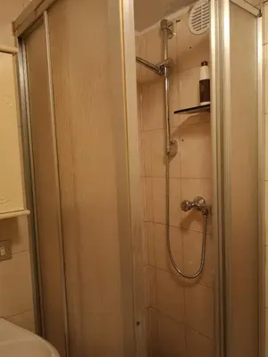 a bathroom with a shower with a glass door at Nido del Melo in Cles