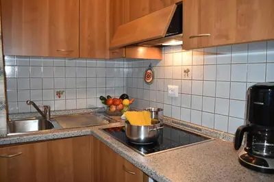 a kitchen with a sink and a counter top at Chalet Pradat in Arabba
