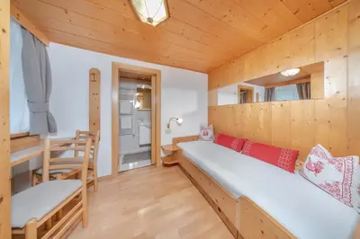 a bathroom with a sink and a toilet and a shower at Garni Tramans in Selva di Val Gardena