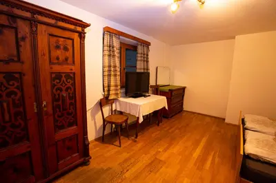 a room with a bedroom with a bed and a television at Gatscherhof Retreat - Family Appartement in Chienes