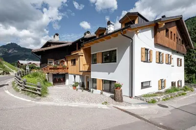 a house on the side of a road at Cèsa Cercenà in Canazei