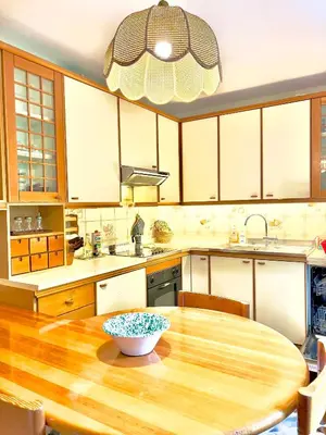 a kitchen with a wooden table with a bowl on it at Ca' Virginia - Val di Fassa in Vigo di Fassa