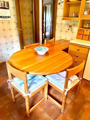 a wooden table in a kitchen with a bowl on it at Ca' Virginia - Val di Fassa in Vigo di Fassa