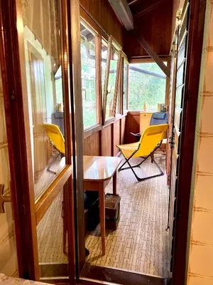 a dining room with yellow chairs and a table at Ca' Virginia - Val di Fassa in Vigo di Fassa