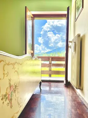 a room with a slide in front of a window at Ca' Virginia - Val di Fassa in Vigo di Fassa