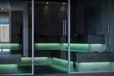 a glass door of a building with green lights at Hotel Rommisa in Perca