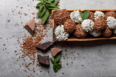 a plate of chocolate desserts on a table at Hotel Rommisa in Perca
