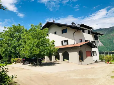 a house with a car parked in front of it at Apartment Kapplerhof in Lana