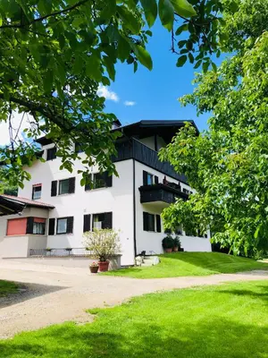 a white building with a black roof at Apartment Kapplerhof in Lana