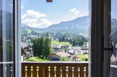 a view of a town from a window at Casa Ronco in Cortina dʼAmpezzo