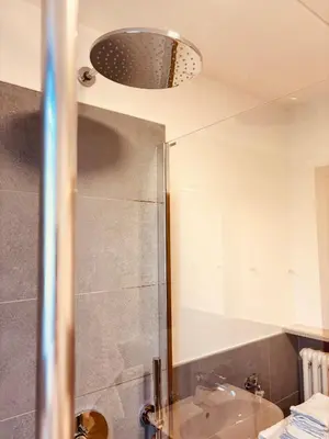 a bathroom with a shower and a sink at Apartment Fiemme Valley in Carano