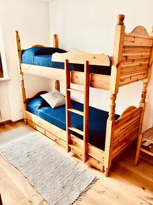 a couple of bunk beds in a room at Apartment Fiemme Valley in Carano