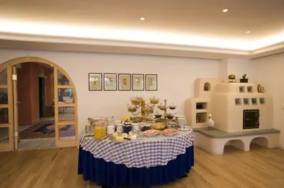 a table with food on it in a room at Residence La Villa in La Villa