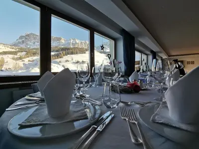 a large building with a mountain in the background at Residence La Villa in La Villa