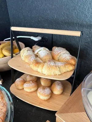 a couple of plates of pastries on a shelf at Fiemme in Vista in Ziano di Fiemme