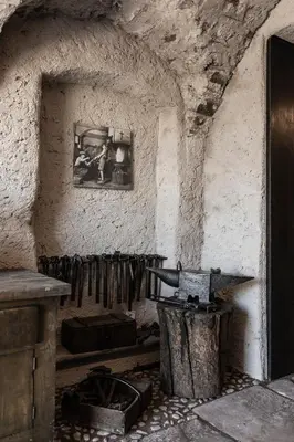 a room with a stove and a picture on the wall at Essa Suites - NEW in Caldaro