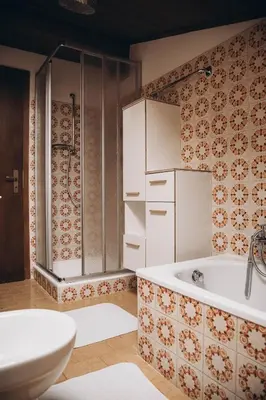 a bathroom with a tub and a toilet and a sink at Farm apartment I neni in Lovara