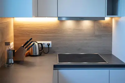 a kitchen with a sink and a counter top at Langegger 1956 in Bolzano