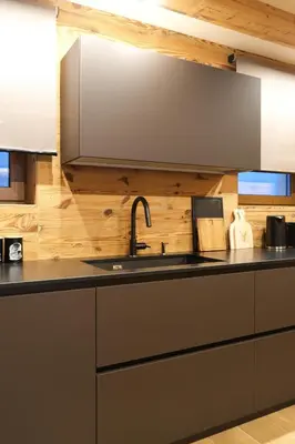 a kitchen with a sink and a counter top at Leos Chalet in Valdaora di Sopra