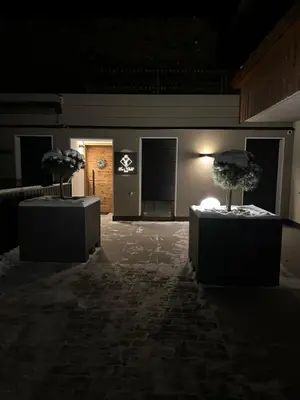 a room with two bonsai trees on display at Leos Chalet in Valdaora di Sopra