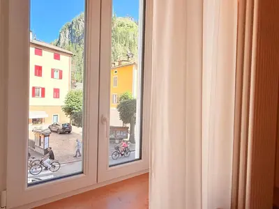 an open window with a view of a street at Il bosco di Fiemme in Predazzo