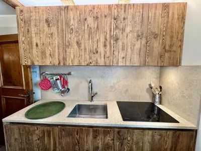 a kitchen with a sink and a counter top at Villa Anna apartment - Center view - in Cortina dʼAmpezzo