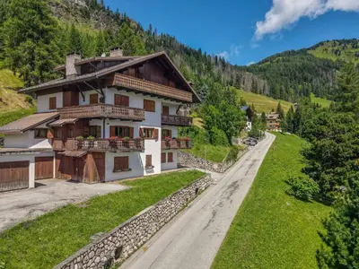 a house on the side of a mountain at Dolomite View Loft in Colle Santa Lucia