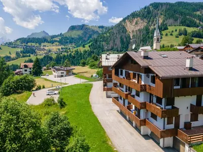 an aerial view of a building in the mountains at Casa dei Gigli in Selva di Cadore