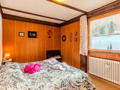 a bedroom with a bed and a window at Chalet Altavista by Interhome in Ziano di Fiemme