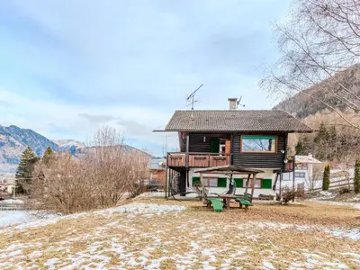 a cabin in the mountains with snow on the ground at Chalet Altavista by Interhome in Ziano di Fiemme