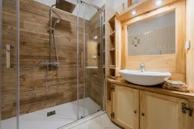 a bathroom with a sink and a shower at Antico Fienile in Borca di Cadore