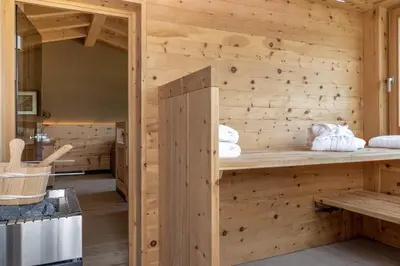 a log cabin with a wooden wall at Haus Lupwald in Falzes