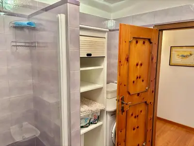 an open door to a refrigerator in a room at Appartamento Olimpiadi 2026 Val di Fiemme in Panchia