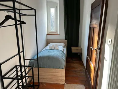 a small room with a bunk bed and a window at Castellino di Castello di fiemme in Castello di Fiemme