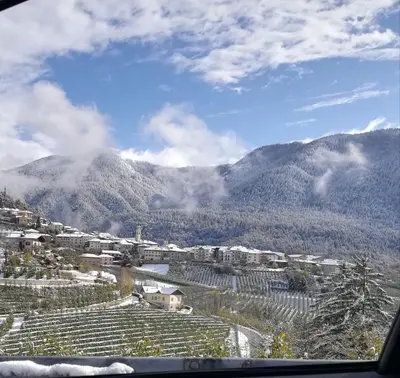 a view of a village with mountains in the background at EmilyNest in Vervò