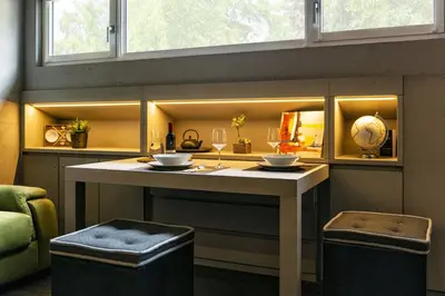 a kitchen with a island with two bowls on it at Loft at 1236 in Ortisei