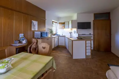 a kitchen with a table and a kitchen with a counter at Bonichhof in Laion