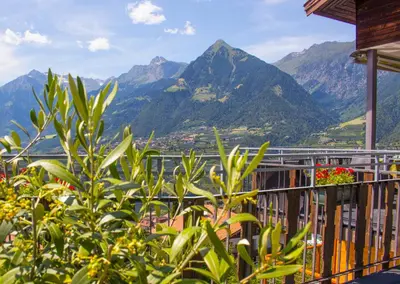 a balcony with a view of a mountain at Schenna Garni Eden Bed & Breakfast in Schenna