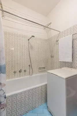 a bathroom with a shower and a bath tub at Casa Bigontina, in pieno centro a Cortina in Cortina dʼAmpezzo