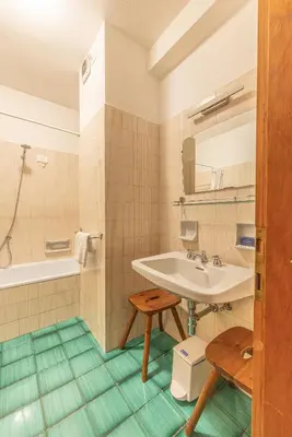 a bathroom with a sink and a tub at Casa Bigontina, in pieno centro a Cortina in Cortina dʼAmpezzo