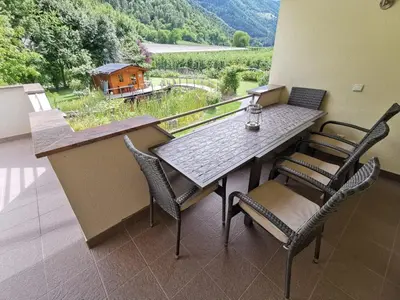 a table and chairs on a balcony with a view at Apartment Dreiland in Plaus