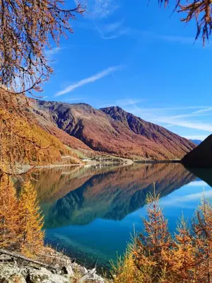 a view of a lake with mountains in the background at Apartment Dreiland in Plaus