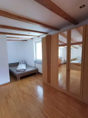 a room with a bed and sliding doors in it at Apartment Dreiland in Plaus