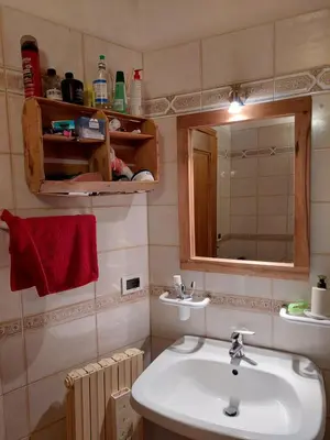 a bathroom with a sink and a mirror at Petit Chalet in Villanova