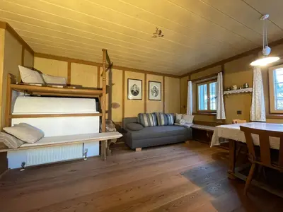 a living room with a bunk bed and a couch at Landhaus Schneider in Vallarga