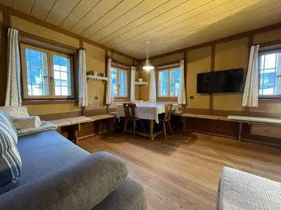 a living room with a couch and a table with a tv at Landhaus Schneider in Vallarga