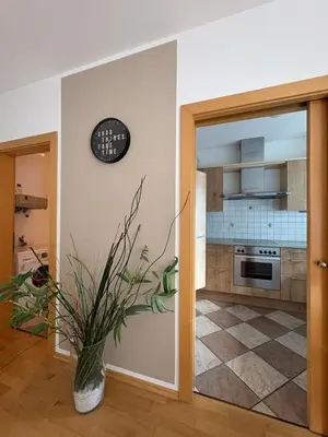 a kitchen with a door open to a kitchen with a stove at Apartment Apfel in Naturno