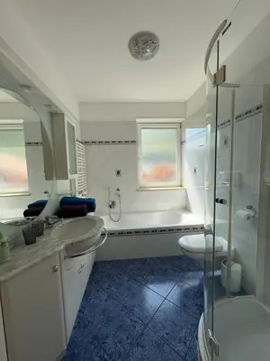a bathroom with a tub and a sink and a shower at Apartment Apfel in Naturno